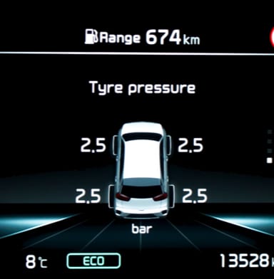 Close-up of the tire pressure reading on a car dashboard