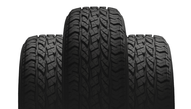 Close-up of three commercial tires against a white backdrop