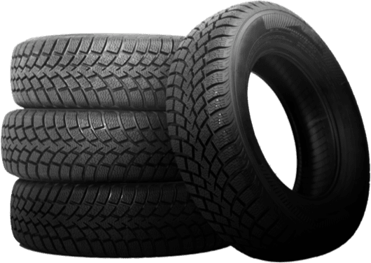 Stack of three tire treads with one leaning against them